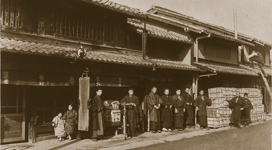 A historical image of Shoyeido employees in front of their store